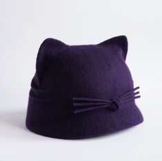 A warm merino wool cat ear hat with a double brim is an indispensable accessory in the cold season. A felted wool hat is warm, cozy and soft, it does not irritate your skin. A cute hat with cat ears is a perfect accessory to create a unique look. Hat with realistic cat ears great gift for cat lovers women. This item is made to order and ready to ship in 3-5 business days after payments. Please choose size and color. ON THE 1st PICTURE: size S, color wool-blackberry. The circumference of your hea Winter Fur Felt Hat, Fitted Winter Hat With Cat Ears, Winter Wool Hat As Gift, Winter Wool Mini Hats, Purple Winter Hat With Curved Brim, Purple Short Brim Winter Hat, Adjustable Felt Hat For Winter, Adjustable Cat Ears Winter Hat, Cute Winter Hat With Short Brim