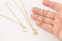 * Material: Stainless Steel * Plating: 14k gold * Colors Gold, Silver and Rose Gold * Size of pendants varies: around 15mm * Nickel free, tarnish free and hypoallergenic!  * Safe to wear in the shower or at the gym! * Makes a great personalized Christmas gift for mom! This amazing minimalist style necklace is a perfect gift for yourself or someone special in your life. Customize it with the initials of your choice. This makes an excellent personalized gift for mom for mothers day, sister or frie Gold Plated Name Necklace With Delicate Chain, 14k Gold Initial Necklace With Adjustable Chain As Gift, Gold Plated Initial Necklace As Gift, Simple Gold Jewelry Gift For Her, Simple Gold Jewelry As A Gift For Her, Simple Gold Jewelry For Her, Gold Name Necklace With Delicate Chain As A Gift, Minimalist 14k Gold Filled Initial Necklace Gift, 14k Gold Initial Necklace With Adjustable Chain