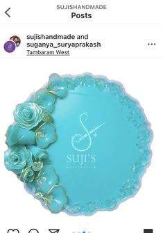 a blue glass plate with flowers on it