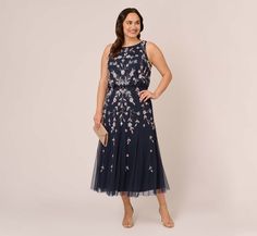 Brilliant blooms take their place on this gorgeous tea-length dress. Featuring a fitted, sleeveless bodice and full skirt, this beaded dress brings the sparkle and romance. Sequins and beads team up into embroidered florals in a mirrored design that flatters the figure. Beading accentsthe hems at the neck and arms. A zipper back closure finishes the design of this floral beaded dress. Complete the look with metallic heels and a S'HUG for added warmth on an evening out. Style Number: AP1E210437 B Floral Beaded Dress, Tea Length Dress, Wedding Guest Style, Metallic Heels, Tea Length Dresses, Maxi Gowns, Tea Length, Beaded Dress, Full Skirt