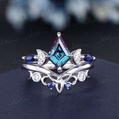 a ring with blue and white stones on it