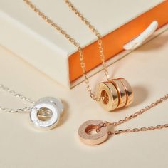 Cherish a never-ending love with the Personalized Unity Name Necklace. This unique design features smooth, round discs, elegantly paired with the classic Merci Maman chains. Add up to 5 discreetly hand-engraved charms to create the perfect personalized gift for someone special.&nbsp;18K Champagne Gold Plated, 925 Sterling Silver or 18K Rose Gold PlatedUnity disc size: Diameter 0.5 and Thickness 0.1Hand engraved in our Paris workshopSent with love in a complimentary gift boxAny slight variations in lettering depth, spacing and alignment from the examples shown are part of the aesthetic and originality of the piece Elegant Engraved Circular Jewelry, Luxury Personalized Sterling Silver Charm Necklace, Elegant Engraved Stainless Steel Charm Necklaces, Elegant Engraved Stainless Steel Charm Necklace, Elegant Stainless Steel Charms Necklace, Elegant Stainless Steel Charm Necklace For Her, Elegant Stainless Steel Charm Necklace As Gift For Her, Elegant Stainless Steel Charm Necklace, Elegant Round Charm Necklaces With Polished Finish