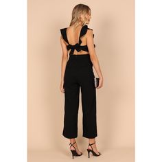 Looking for a jumpsuit that will make you feel like the life of the party? Look no further than this round neckline beauty! Featuring non adjustable straps with ruffle detail and a back opening with tie close, it's sure to turn heads. Backless Jumpsuit With Tie Back For Night Out, Backless Tie-back Jumpsuit For Night Out, Black Tie Back Jumpsuit For Night Out, Black Tie Back Jumpsuits And Rompers For Party, Backless Jumpsuit With Tie Back For Date Night, Black Tie-back Jumpsuits And Rompers For Party, Chic Spring Jumpsuits And Rompers With Ruffled Straps, Chic Jumpsuits And Rompers With Ruffled Straps For Spring, Flirty Backless Jumpsuit For Date Night