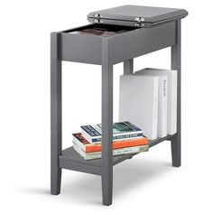 a small gray table with books and binders on it