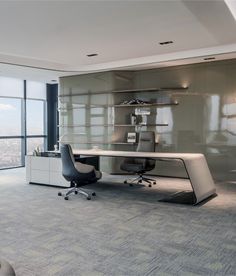 an office with a desk and chair in front of a large window overlooking the city