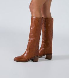 Apache Toffee Como Calf Boots | Boots | Tony Bianco USA Calf High Boots Outfit, Light Brown Cowboy Boots, Tony Bianco Boots, Brown Cowboy Boots Outfit, Shoe List, 70s Boots, 2024 Shoes, Boots 2024, Mountain Mama