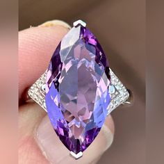 8.55ct Marquise Brazilian Amethyst With .11ctw White Zircon Rhodium Over Sterling Silver Ring. .72"L X .93"W. Finished Under Gallery. Accent Stones Primarily Zircon. Ring Attributes: Metal Weight2.61 G Band Width0.07 In Material Sterling Silver Finish Rhodium Primary Stone Amethyst Gemstone & Info If You Are Fortunate Enough To Be Born In February, Amethyst Is Your Birthstone. This Wonderful Member Of The Quartz Family Often Forms Large, Six-Sided Crystals. It's Usually Quite Clear And Can Be Cut Into Almost Every Shape, Which Makes It Ideal For Jewelry. Because Amethyst Is A 7 On The Mohs Scale Of Hardness, It's Very Wearable. Versatile Amethyst Offers A Wide Variety Of Shades, From Reddis Elegant Marquise Amethyst Jewelry, Classic Amethyst Gemstones With Accents, Marquise Amethyst Jewelry With Accent Stones, Elegant Amethyst Gemstones With Diamond Accents, Silver Amethyst Gemstones For Formal Events, Purple Amethyst Gemstones With Diamond Accents, Formal Sterling Silver Gemstones With Diamond Accents, 14k White Gold Gemstones, Luxury Amethyst Ring With Gemstone Accents