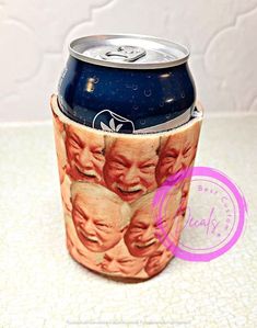 a can holder with an image of faces on it