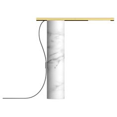 a white marble lamp with a yellow cord