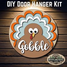 the diy door hanger kit is designed to look like a turkey with an orange beak