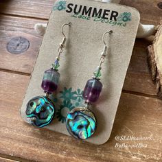 Abalone earrings shell jewelry flourite gemstone silver bohemian beach purple earrings dangle boho crystal unique jewelry earrings for women Drop length: 1.5 inches These beach beauties have 14mm abalone shell beads, 12mm fluorite gemstone beads, 4mm Swarovski crystal beads, silver plated findings and ear wires. Unique boho earrings from SLDbeadwork. Earrings for women. Yes, please. I love to rock a great pair of earrings. Stone, crystal, lampwork, beaded earrings, well I love all of them Can't Handmade Purple Bohemian Crystal Earrings, Handmade Bohemian Purple Crystal Earrings, Purple Bohemian Earrings For Beach, Purple Dangle Jewelry For Beach, Bohemian Sterling Silver Earrings For Beach, Sterling Silver Bohemian Earrings For Beach, Purple Earrings For Summer Beach, Purple Drop Earrings For The Beach, Purple Drop Earrings For Beach