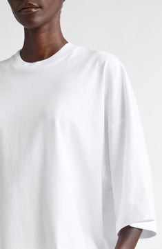 The label highlights its focus on clean lines and minimalist aesthetics with this boxy, softly oversized T-shirt cut from fresh cotton. 25" length (size X-Small) Crewneck Elbow-length sleeves 100% cotton Dry clean or machine wash, dry flat Made in Italy Designer Clothing T Shirt Cut, Fabric Gift Bags, Cut Tshirt, Oversized T Shirt, Elbow Length Sleeve, Fabric Gifts, Free Fabric, Cut Shirts, Anniversary Sale