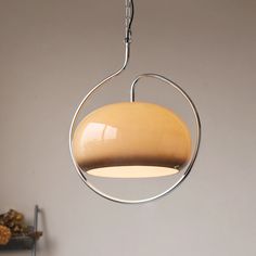 a circular light fixture hanging from a ceiling