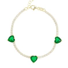 Light up your love in lush emerald and celestial jewels. Our Emerald Hearts Trifecta Bracelet brings a little glamour into your everyday, capturing the essence of sweetness and radiance in its trio of love gems strung on a strand of perfect crystals. Wear with our Oasis Emerald Heart Choker to elevate your sweetheart style to a love supreme. 14k gold plated sterling silver Crystal clear pavé and emerald stones 6-7" Adjustable in length Green Cubic Zirconia Heart Cut Jewelry, Green Heart-shaped Jewelry Gift For Her, Emerald Jewelry With Heart Charm As Gift, Adjustable Green Cubic Zirconia Jewelry, Green Heart Beads Bracelet, Green Heart-shaped Promise Jewelry, Green Heart-shaped Jewelry For Promise, Green Heart Beads Bracelet Jewelry, Elegant Emerald Jewelry With Heart Charm