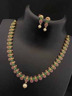 The floral-inspired design, adorned with CZ crystals and American diamonds, creates a captivating ensemble that effortlessly elevates your style. Craftsmanship with the multicolor stones adds a vibrant touch, making this jewel set a perfect choice for any occasion. Floral Choker, American Diamond Necklaces, Oxidized Necklace, Bangle Ring, Choker Set, Fashion Jewelry Sets, Jhumka Earrings, American Diamond, Pearl Studs