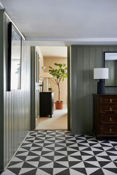 the hallway is decorated with black and white tiles