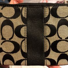 Never Used. Black And Tan Wristlet. Trendy Rectangular Coach Clutch, Chic Coach Wristlet With Removable Pouch, Trendy Coach Clutch For Travel, Trendy Coach Rectangular Clutch, Chic Coach Coin Purse For Everyday Use, Trendy Everyday Coach Clutch, Casual Black Wristlet For Everyday Use, Trendy Coach Clutch With Removable Pouch, Chic Coach Wristlet For Daily Use