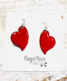 Heart Earrings ~ Red Enamel Minimalist Asymmetrical Heart Drop Earrings by MagpieMouseStudios on Etsy https://www.etsy.com/listing/750341562/heart-earrings-red-enamel-minimalist Enamel Heart Charm Earrings As Gift, Heart Charm Enamel Earrings, Heart-shaped Enamel Earrings With Charm, Enamel Earrings With Heart Charm As Gift, Valentine's Day Heart Charm Enamel Earrings, Handmade Heart-shaped Enamel Earrings, Red Heart Pendant Earrings For Anniversary, Valentine's Day Enamel Dangle Earrings, Valentine's Day Gift Enamel Earrings