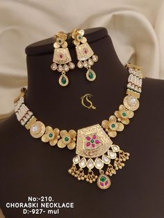 Description :- kundan Jumka necklace set, Short necklace with Long earrings, Rings, Maang Tikka, Full Combo, Bridal Wear, Wedding Wear, only 1pcs  Gift yourself a royal look with this perfectly crafted kundan necklace set from Manalisstudio. Crafted with high quality kundan stones and pearls, it is impressive in design. The green enamel artwork adds perfect texture to the design. Perfect for weddings and festivities, this antique necklace set should be put on with your favorite sari or lehenga. White Kundan Necklace With Intricate Design For Marriage, Kundan Meenakari Necklace For Marriage, Kundan Jewelry Set With Meenakari For Celebration, Bollywood Style Chandbali Kundan Necklace For Marriage, White Kundan Jewelry Sets For Marriage, Hand Set Kundan Necklace For Marriage, Bollywood Style Kundan Necklace For Marriage And Diwali, Bollywood Kundan Necklace For Diwali Marriage, White Kundan Jewelry Sets With Intricate Design