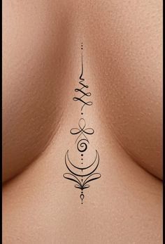 the back of a woman's breast with an ornamental design on it