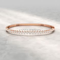 Celebrate milestones this Thanksgiving with our exquisite Graduation Cuff Bangle Bracelet. Adorned with 2.00 carats of radiant lab-grown diamonds, each gemstone symbolizes growth and achievement, making it the perfect Thanksgiving gift for your loved ones. As the April birthstone, the diamonds add meaning and brilliance, representing life’s important milestones. Crafted with precision and designed for personalization, you can engrave this beautiful piece to create a timeless treasure. Whether fo Formal 14k Gold Diamond Bangle Bracelet, 14k Gold Diamond Bangle For Formal Occasions, Elegant 14k Gold Diamond Bangle Bracelet, 14k Gold Bangle With Diamond Accents For Everyday Luxury, Rose Gold Polished Diamond Bangle Bracelet, Add Meaning, Diamond Earrings Design, Stacked Wedding Rings, Perfect Thanksgiving