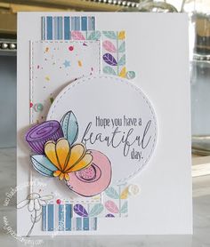 a close up of a greeting card with flowers on the front and bottom, which reads have you have a beautiful day