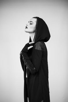 Long cotton lycra jacket designed with eco leather and lace on the back side. The model on the picture is wearing size S. Big hood, no zipper, no pockets, with thumbholes. Collection 'DISTRESSOR' Spring '21 Futuristic Hooded Jacket With Detachable Hood, Futuristic Hooded Jacket For Fall, Black Futuristic Outerwear For Alternative Fashion, Fitted Techwear Hooded Jacket For Streetwear, Fitted Futuristic Black Outerwear, Fitted Hooded Alternative Outerwear, Fitted Techwear Hooded Jacket, Fitted Hooded Techwear Outerwear, Edgy Hooded Outerwear For Cosplay