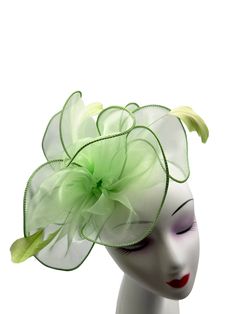 A Brand New light green Colour Fascinator With cloth fabric forming a beautiful layered flower with a burst of feathers, thus making a beautifully crafted fascinator. Made up of cloth fabric and feathers The length of the fascintor is approximately 20cm and its width at the widest point is 19cm. This Fascinator comes in with a light green colour headband and a metal clip as an attachment. These are removable and can be used according to your need. This allows you to wear the fascinator at differ Elegant Feathered Headband For Summer, Summer Feather Headband Fascinator, Summer Race Day Feather Hair Accessories, Green Handmade Flowers Wedding Fascinator, Elegant Green Hair Accessories For Wedding, Spring Feather Headband For Races, Green Feathered Headpiece For Weddings, Green Wedding Fascinator With Feathers, Green Mini Hat With Feathers For Party