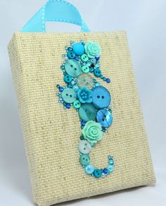 a bag with buttons and flowers on it