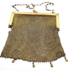 Goldine CB Art Deco mesh gold toned antique hand bag purse. Good used condition with small signs of normal wear. There are a few chain loops missing on one side of the frame where the hinge bends as seen in pictures. Stamped on the inside of the frame Goldine CB. The outside of the frame has a monogram BUK and flowers on each corner. Purse measures 5 and 1/2 inches tall and 5 inches wide. Victorian Gold Bag As Gift, Handmade Victorian Gold Bags, Vintage Gold Bag With Chain, Antique Gold Rectangular Evening Bag, Antique Handmade Gold Evening Bag, Antique Gold Bag For Gift, Antique Gold Handmade Evening Bag, Antique Gold Rectangular Bag, Antique Gold Evening Bag