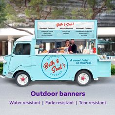 an outdoor food truck is parked in front of a building