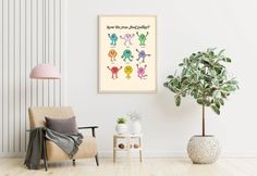 a living room with a chair, potted plant and framed art on the wall