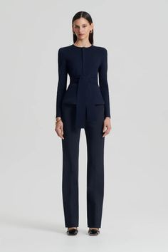 The Curved Hem Jacket in Navy closes at the front with a zip and includes a separate belt to be worn high around the waist. The Curved Hem kicks up and breaks the line across the hip. This jacket is very popular because of its simplicity. The shoulder line, slim long sleeve, neckline, and peplum all serve to streamline and elongate the body. Navy Blue Suit Outfits Women, Navy Blue Suit Outfit, Blue Suit Outfit, Blazer Belt, Italian Chic, Zendaya Outfits, Work Fits, Scanlan Theodore, Navy Blue Suit