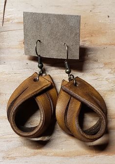 Leather earrings, loop, rustic, non-allergen hardware, cowgirl, classy. Brand new, never been worn. Approximately 1 inch by 1.5 inches.