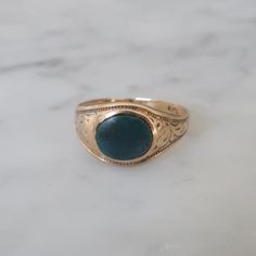 The cutest little bloodstone ring from circa 1930. Fabricated in a very Victorian style this ring is marked for 10kt gold which makes me think it is not Victorian butt rather vintage from the 1930's. Love the engraved detail on the sides and the extremely low profile of the ring. This ring has been very loved and worn over the years. Condition is good but well loved see pictures. Price refelects the worn nature of this adorable ring. currently this ring is a size 5.5. Bloodstone Ring, Ring Antique, Pinky Ring, Victorian Style, Ring Vintage, Victorian Fashion, Rings Statement, Vintage Rings, Statement Rings