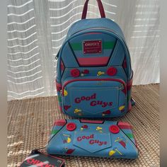 Chucky Good Guys Lounge Fly Bag And Wallet Set New Blue Leather Bag With Card Slots, 80s Slasher, Loungefly Wallet, Owl Coin Purse, Sanrio Clothes, Lounge Fly, Disney 50th Anniversary, Disney Brave, Spooky Stuff