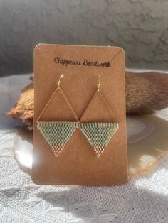 These stunning gold and avocado colored earrings are perfect for everyday wear!     Made with: * brass triangles   * 11/0 Miyuki beads  * 11/0 Miyuki gold-plated beads  * gold plated earring hooks     Thank you for supporting my small business. All designs are hand made in Phoenix, Arizona. Please do not replicate. Gold Triangle Beaded Bohemian Earrings, Summer Gold Beaded Nickel-free Earrings, Gold Teardrop Beaded Earrings, Gold Beaded Nickel-free Earrings For Summer, Geometric Beaded Gold Jewelry, Geometric Gold Beaded Jewelry, Gold Geometric Beaded Jewelry, Gold Beaded Geometric Jewelry, Geometric Beaded Gold Earrings