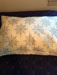 a pillow that has snowflakes on it