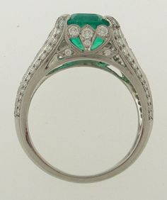 A Green 3.19ct Emerald From Colombia, Set in a Fancy Platinum Ring with Diamonds that weigh a total of 0.85ctw, H/VS Respectively. Ring Weight is 7.8 Grams. Currently a Finger Size of 6.5 and Will Be Sized to Fit!!! Luxury Pear-shaped Brilliant Cut Emerald Ring, Oval Emerald Ring With Pave Setting In Platinum, Luxury Pear-shaped Rings With Pave Setting, Luxury Pear-shaped Emerald Ring With Prong Setting, Gia Certified Pear-shaped Diamond Emerald Ring, Green Platinum Jewelry With Pave Setting, Dazzling Oval Emerald Ring In Platinum, Green Platinum Ring With Pavé Setting, Luxury Pear-shaped Diamond Ring With Pavé Setting