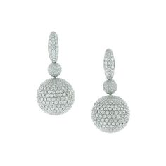 A magical pair of earrings featuring 12.80 carats of VS quality round cut diamonds set into 18K white gold spheres. The spheres, which are completely covered in diamond pave, spin and rotate freely from the drop adding movement to the piece. A special pair of earrings, quality craft.    Dimensions: 1.40 x 0.50 inches White Gold Drop Earrings, Trillion Diamonds, White Gold Diamond Earrings, Pave Jewelry, Diamond Earrings Design, Earrings Design, Long Drop Earrings, Gold Diamond Earrings, Earring Crafts