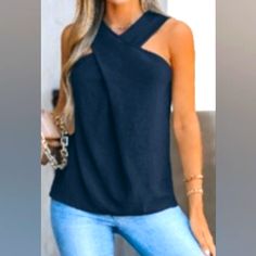 Sleeveless Navy Crossover Top Casual Sleeveless Halter Top For Night Out, Blue Stretch Halter Top, Blue Stretch Sleeveless Halter Top, Sleeveless Summer Tops For Night Out, Summer Sleeveless Tops For Night Out, Sleeveless Tops With Crisscross Straps For Night Out, Sleeveless Tank Top With Crisscross Straps For Vacation, Vacation Tank Top With Crisscross Straps, Chic Blue Stretch Tank Top