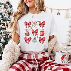 Spread holiday cheer with our Funny Christmas Shirt, perfect for adding an adorable vibe to the festive season. Made from soft, cozy fabric, this shirt features a witty Christmas-themed design that's sure to get looks at every holiday gathering. Whether you're at a family party or a work event, it's the ideal way to show your merry side. Bella and Canvas Brand shirts Unisex Adult Sizing Short sleeved and soft quality Runs True to Size PRINT This shirt is a Direct to Garment printed item where th Vintage Christmas Shirt, Retro Santa, Bow Shirt, Santa Shirt, Bow Shirts, Santa Shirts, Christmas Bow, Cozy Fabric, Brand Shirts