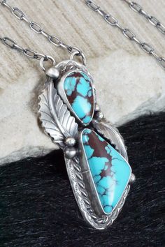 This turquoise and sterling silver necklace was strung by Navajo silversmith Betta Lee. The back of the necklace is signed B. Lee and stamped sterling.Necklace: 19"Length: 2"Width: 7/8"Free shipping on all orders! We ship with USPS and always include tracking. All orders ship within a day of payment.Returns are accepted up to 30 days after you receive your order. Just send us a message. Our shop offers cash back or store credit. The item must be returned in new condition. Traditional Turquoise Necklace With Large Sterling Silver Pendant, Western Style Collectible Turquoise Sterling Silver Necklace, Southwestern Untreated Turquoise Collectible Necklace, Southwestern Sterling Silver Turquoise Necklace Collectible, Southwestern Turquoise Sterling Silver Collectible Necklace, Unique Silver Turquoise Necklace Hand-strung, Turquoise Necklaces, Navajo Turqoise Necklace, Sterling Necklace