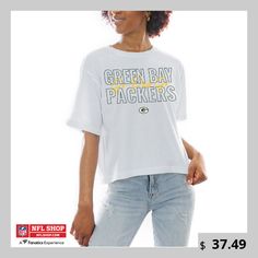 Show out for your Green Bay Packers in this Keep Playing Boxy Fit T-Shirt from Gameday Couture. The team logo and wordmark is backed up by a recognizable Green Bay Packers saying, making this tee great for game days. Its cropped hem provides the perfect fit for a comfortable and stylish wear. Sporty Logo Tops For College, Casual Tops With Logo Lettering, Crew Neck Tops With Logo For Sports Season, Collegiate Logo Crew Neck Tops, Collegiate Cotton Tops With Logo, Collegiate Crew Neck Top With Logo, Crew Neck T-shirt With Team Spirit, Graphic Tee With Logo For Fan Merchandise, Fan Merchandise Graphic Tee With Logo