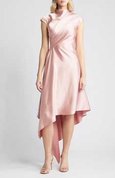 a woman is wearing a pink dress with an asymmetrically draped over it