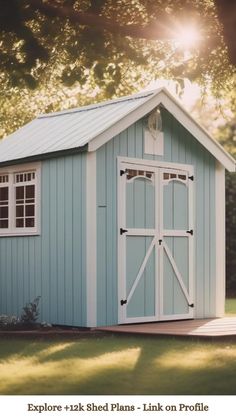 a blue shed with white trim and windows