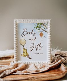 a card with the words books and gifts written on it next to a pile of blankets