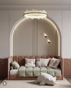 a living room filled with lots of furniture next to a wall mounted light above it