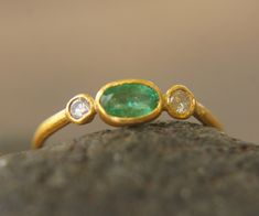 24k diamond ring//artisan emerald ring//emerald 24k ring//engagement earrings//24k gold ring//24k gold diamond emerald ring//gold emerald A new collection was born today. I really love my new rings. stones are: Diamonds SI 2.5 mm (2 stones) 6X4 mm emerald I used 24k gold for the setting and 22k for the rest of the wire ring (1.4 mm) I have done matching studs, and I can make a matching pendant/bracelet. with any custom order you desire. the feel and the color combination with the diamonds and em Elegant 22k Gold Green Ring, Elegant Green 22k Gold Rings, Gold Rings With Single Cut Diamonds And Emerald, Elegant 22k Gold Emerald Ring, Rings Stones, Diamond Emerald Ring, Boho Engagement Ring, Smaragd Ring, Emerald Wedding Rings