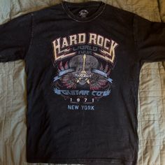 Hard Rock Cafe Band T-Shirt X-Small But Oversized I Normally Wear A Medium And This Fits Me Great Condition Never Worn Black Cotton T-Shirt Distressed Rock T-shirt For Streetwear, Rocker Style Distressed Crew Neck T-shirt, Rock And Roll Graphic Crew Neck Top, Rock And Roll Crew Neck Top With Graphic Design, Rock Style Graphic T-shirt For Streetwear, Rocker Distressed T-shirt For Concert, Rock Style Graphic Print T-shirt For Streetwear, Rock Style Crew Neck T-shirt For Concert, Rock Style Logo Print Tops For Concert